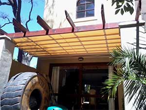 Pergola structure fitted with canvas patioshade